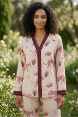 Woman wearing a patterned outfit in a garden setting