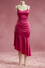 Pink dress on a mannequin against a pink background