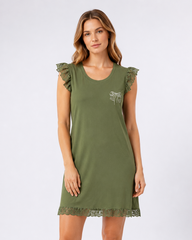 Woman wearing a green nightdress with lace details on a white background