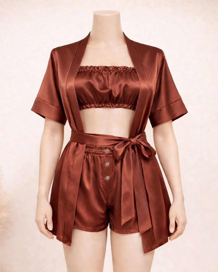Brown satin outfit on a mannequin against a neutral background