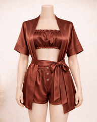 Brown satin outfit on a mannequin against a neutral background