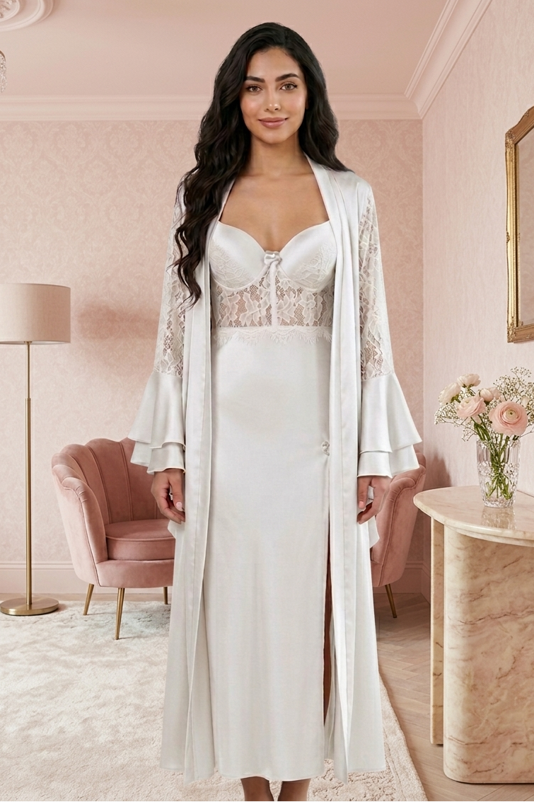 Woman in a white lace dress with a matching robe in a stylish room.