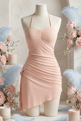Pink dress on a mannequin with floral decorations and candles in the background